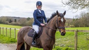 A rider dressed for showjumping