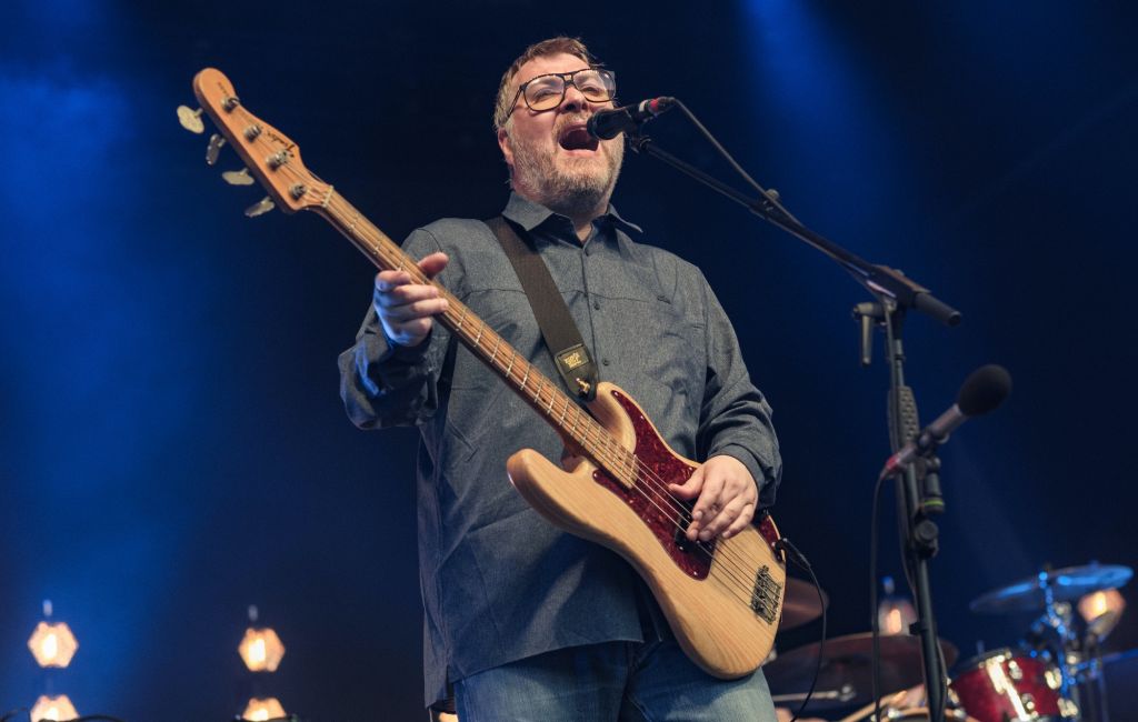 Jimi Goodwin performing live on stage with Doves