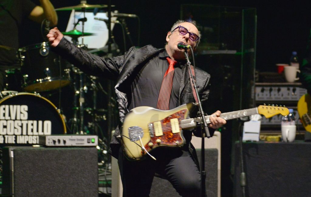 Elvis Costello performing live on stage with The Imposters