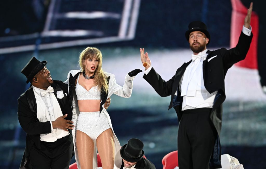 Taylor Swift is joined on stage by Travis Kelce (R), during "Taylor Swift | The Eras Tour" at Wembley Stadium on June 23, 2024 in London, England