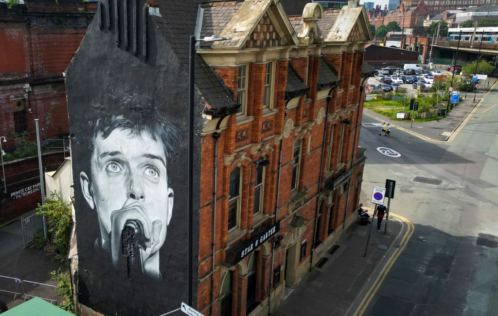 Mural of Joy Division's Ian Curtis on the side of the Star & Garter