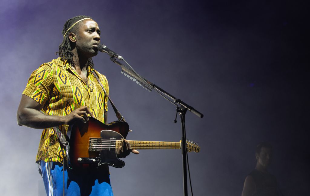 Kele Okereke performing live on stage with Bloc Party