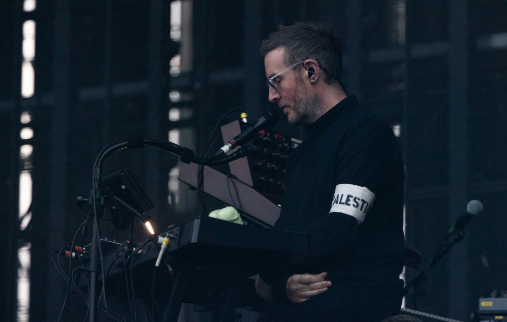 Robert Del Naja of Massive Attack performing live on stage