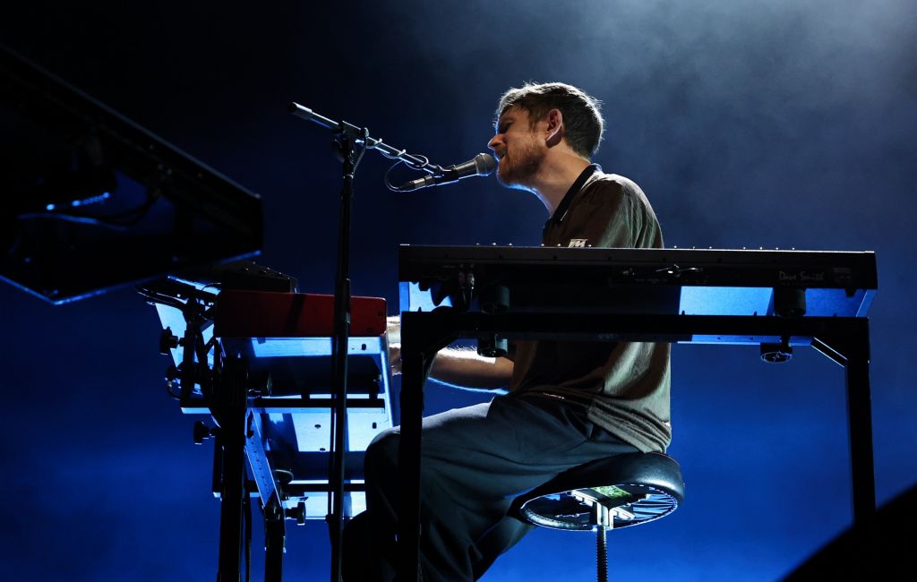 James Blake performing live on stage