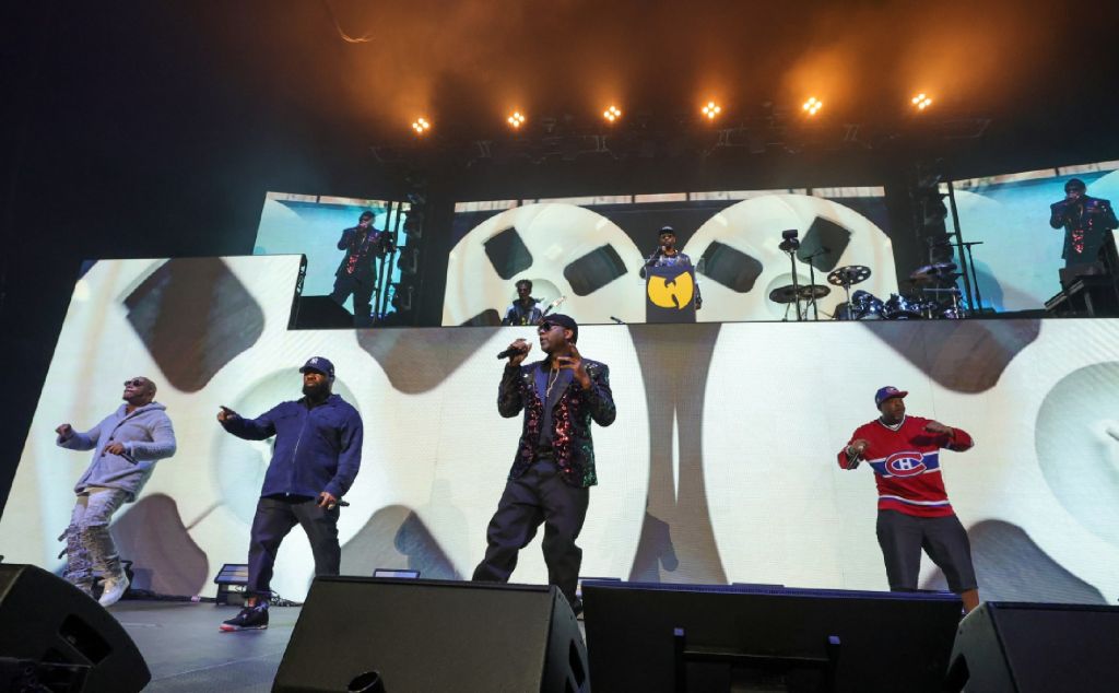 RZA (top) and (L-R) U-God, Raekwon, Masta Killa and Cappadonna of Wu-Tang Clan performing. Credit - Ethan Miller/Getty Images