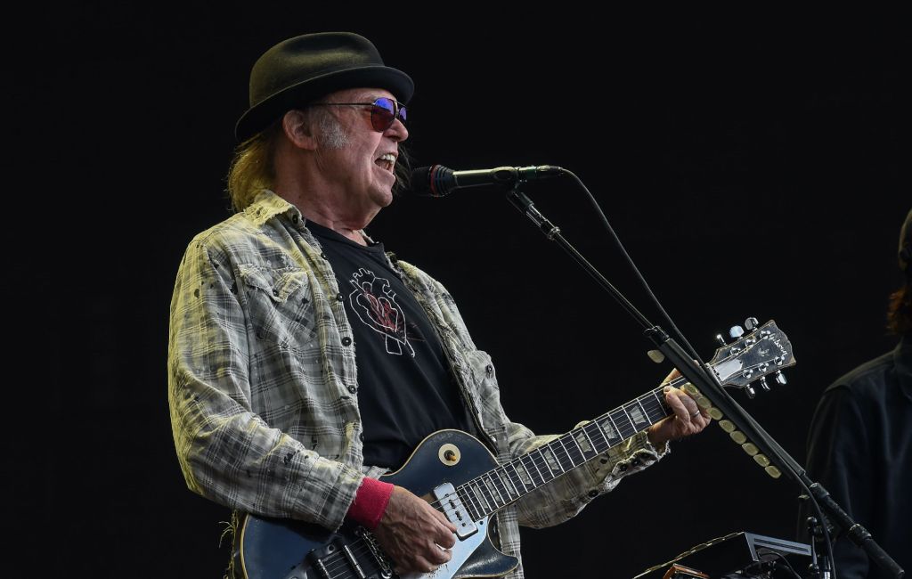 Neil Young performing live on stage