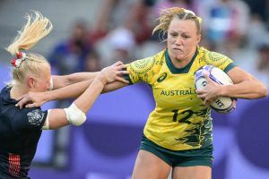 Maddison Levi dodges a tackle from Britain’s Heather Cowell at the Paris Olympics.