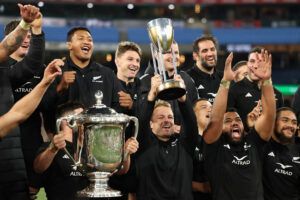 All Blacks captain Sam Cane celebrates with team mates after winning The Rugby Championship