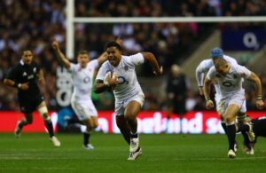 England's Manu Tuilagi scores a try against New Zealand at Twickenham.