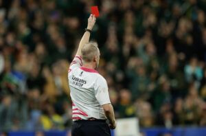 Referee Wayne Barnes of shows a red card to New Zealand captain Sam Kane during the Rugby World Cup 2023 Final