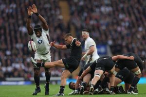 England's lock Maro Itoje attempts to charge down a box kick from New Zealand's scrum-half Cortez Ratima during the Autumn Nations Series.