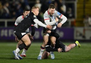 Saracens' Elliot Daly tries to get past Newcastle Falcons players in their November 2024 Premiership clash