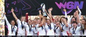 Marlie Packer (L) and Zoe Aldcroft raise the Six Nations trophy as England celebrate after their Grand Slam Six Nations victory during the Guinness Women's Six Nations 2024.