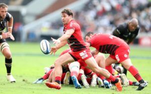 Toulouse's Antoine Dupont shapes up to kick during his team’s January 2025 match against the Sharks.