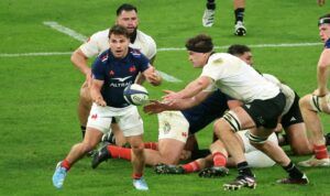 France's Antoine Dupont evades the attention of New Zealand's Scott Barrett during the sides' Autumn Nations Series 2024 match.