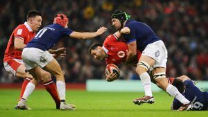 Wales Tomos Williams is tackled by France's Cyril Baille and Nolann Le Garrec during the Guinness Six Nations 2024 match between Wales and France at Principality Stadium on March 10, 2024 in Cardiff, Wales.