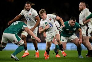 England’s Fin Smith runs with the ball during his team's February 2025 Six Nations match against Ireland