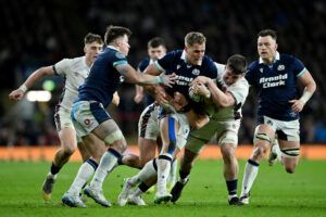 Scotland’s Duhan van der Merwe attempts to make it past England tacklers during the February 2025 Calcutta Cup match.