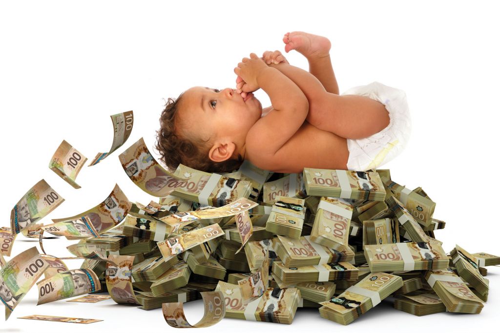 In a photo illustration, a baby in diapers sucking his thumb lies on a pile of money. Some of the bills are floating away