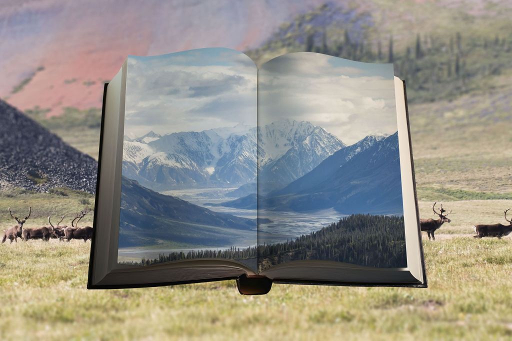 A photo illustration showing a scene of the Yukon wilderness. A book open to pages showing mountains is in the foreground