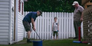 Justin, Jude and grandad Randy playing golf.