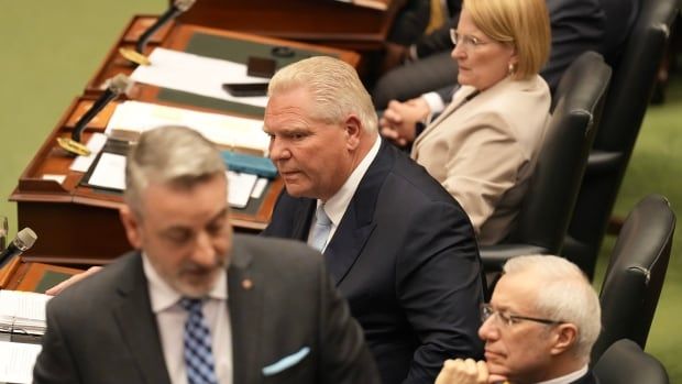 Ontario Premier Doug Ford (centre) reacts as  Paul Calandra, Minister of Municipal Affairs and Housing, at the Ontario Legislature in Toronto, on Tuesday, May 28, 2024.