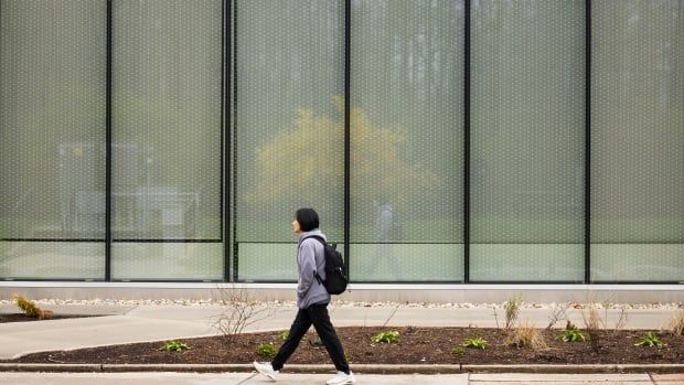 A student walks on the Conestoga College campus in Kitchener, Ont., Saturday, April 27, 2024. 