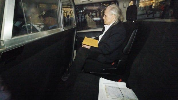 Peter Nygard in a vehicle arriving at Toronto courthouse.