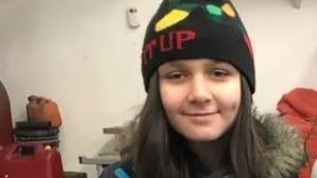 A girl wearing a toque. 