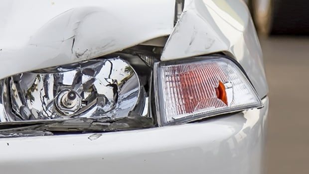 A cracked car headlight and flasher light.