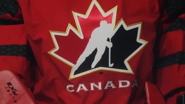 A Hockey Canada logo on a red ice hockey jersey.