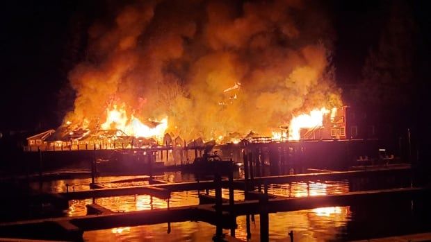 A wooden structure engulfed in flames.