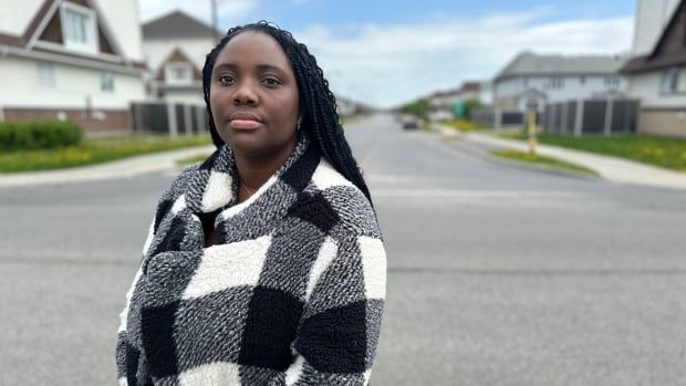 woman on road in black and white jacket