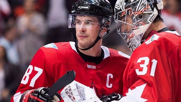 Canada captain Sidney Crosby and Canada goalie Carey Price celebrate after defeating the Czech Republic during third period World Cup of Hockey action in Toronto on September 17, 2016.