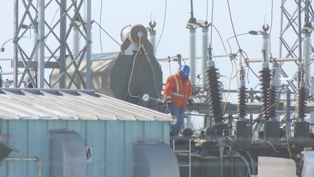 An electrical worker in a substation.