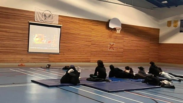 Children pictured watching a video at Umiujaq's youth house