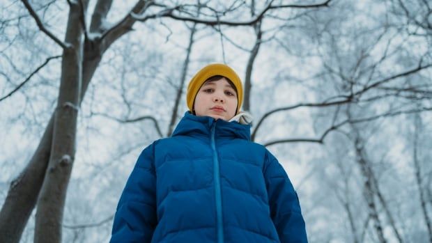 A stock image of a child in a winter coat