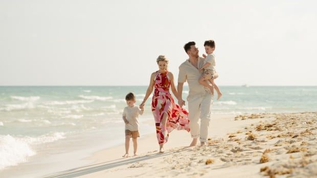 People walking on a beach.