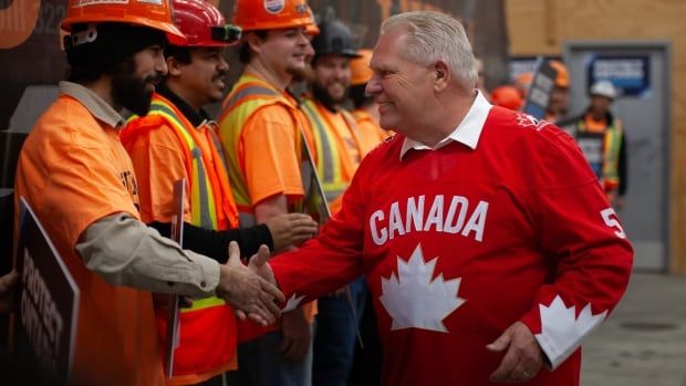 Ontario Progressive Conservative Leader Doug Ford greets workers during a campaign event in Oldcastle, Ont., just outside Windsor, on Wednesday, Feb.26, 2025.