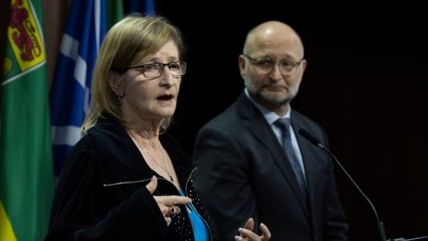 Minister of Justice and Attorney General of Canada David Lametti looks on as Susan Milgaard, sister of wrongfully convicted David Milgaard, speaks during a news conference on Parliament Hill, Thursday in Ottawa.  