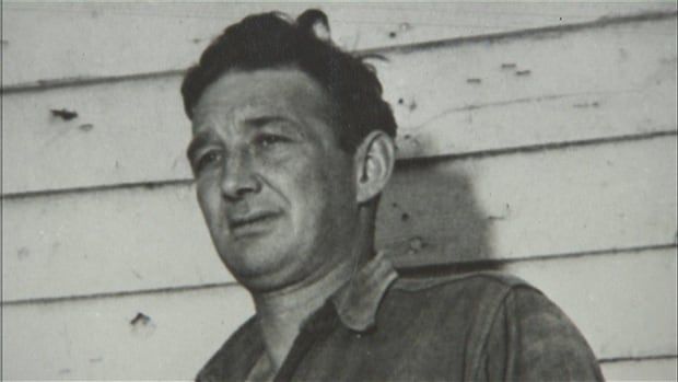 A black and white photo of a man 