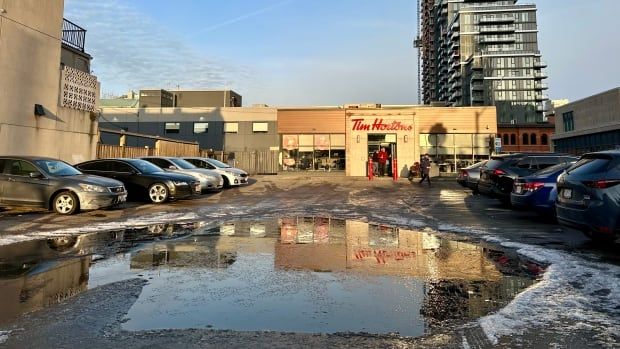 large puddle in parking lot