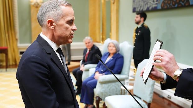 Mark Carney is sworn in as prime minister during a ceremony at Rideau Hall in Ottawa on Friday, March 14, 2025.