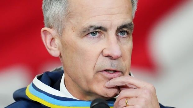 Prime Minister Mark Carney answers questions from the media after making an announcement at a Canadian Armed Forces forward-operating location in Iqaluit, Nunavut, on Tuesday, March 18, 2025.