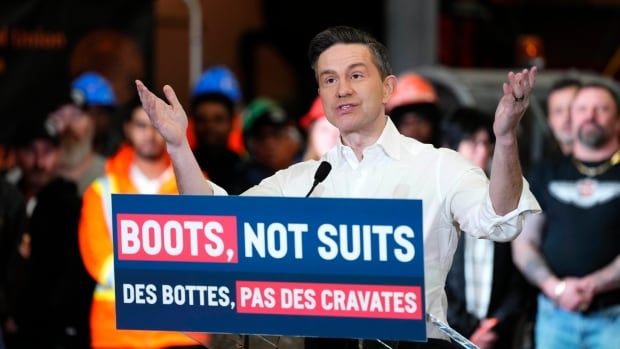 Conservative Leader Pierre Poilievre stands at a podium adorned with a sign that says "boots not suits"