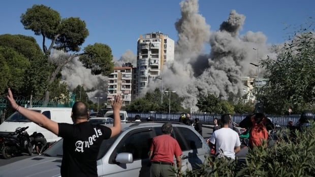 Smoke rises from an  apartment complex