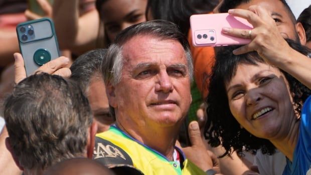 Jair Bolsonaro, the former president of Brazil, is seen posing for a photo, during an event in Brazil's Goias state in September.