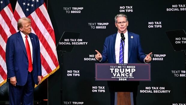 Donald Trump is seen listening, as investor Scott Bessent speaks at at event in Asheville, N.C., in August 2024.