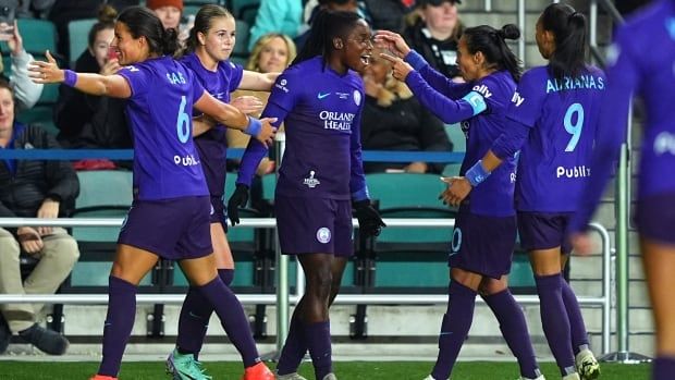 Orlando Pride female players celebrate after scoring a goal against the Washington Spirit during the first half of the NWSL 2024 Championship Game at CPKC Stadium on November 23, 2024 in Kansas City, Missouri.