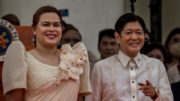 Dark-haired Asian man and woman are shown smiling. 